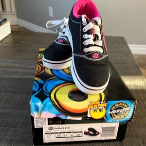 Heelys wheeled shoes.